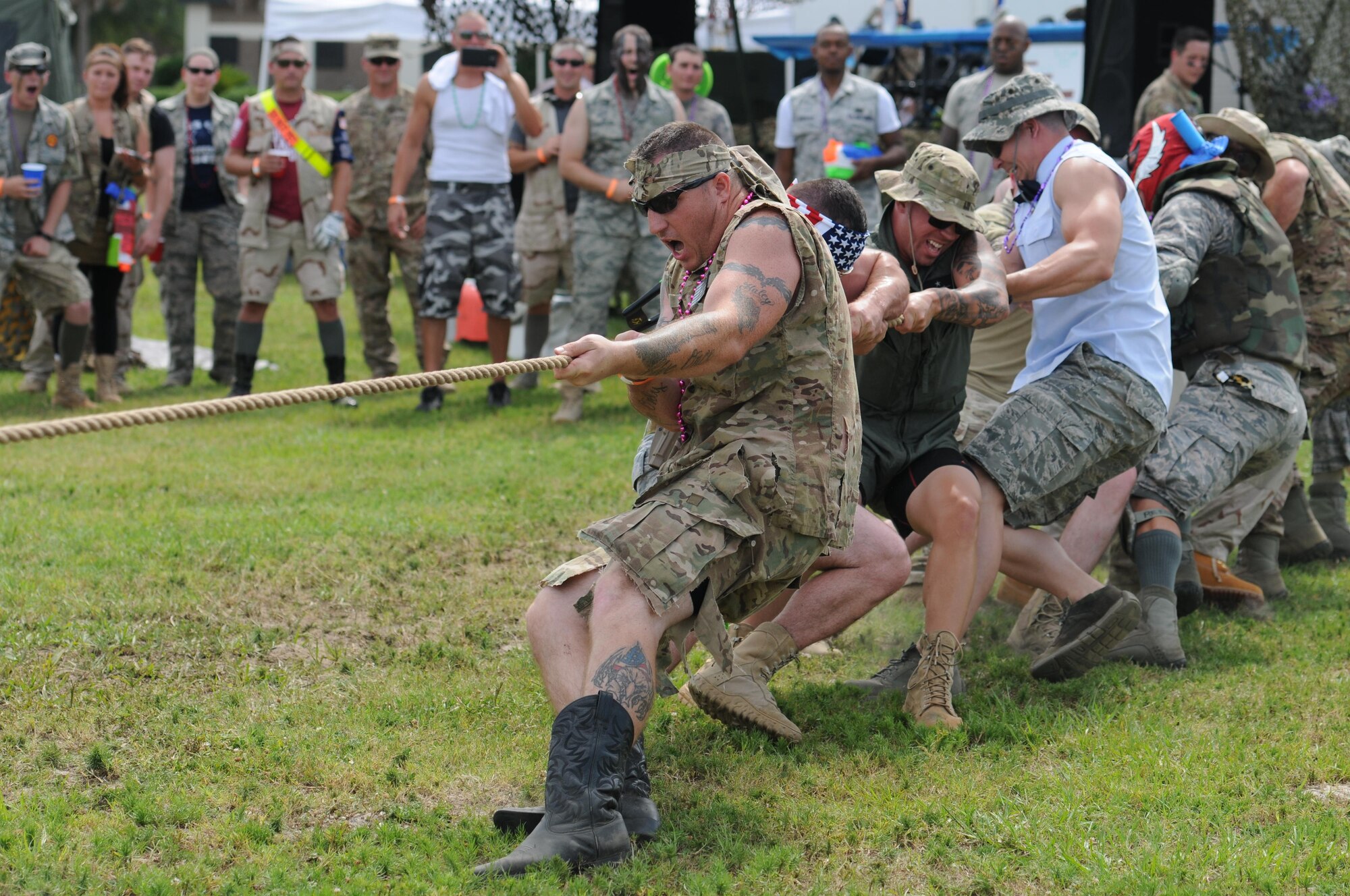 Members of the 81st Security Forces Squadron compete in the tug-of-war contest during the 81st Mission Support Group Combat Dining-In June 10, 2016, Keesler Air Force Base, Miss. The Combat Dining-In is a military tradition that promotes camaraderie and esprit de corps throughout the ranks. (U.S. Air Force photo by Kemberly Groue)