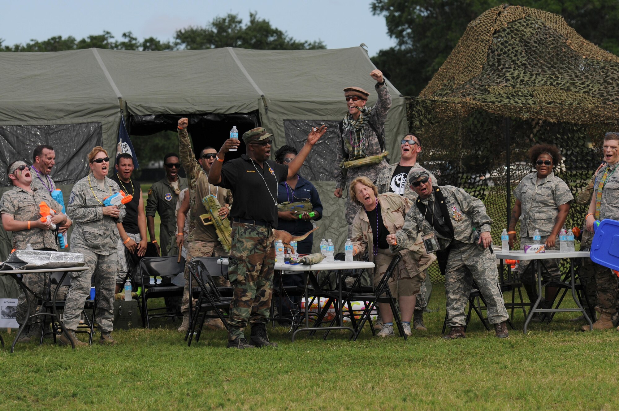 Members of the 81st Communications Squadron yell a chant for roll call during the 81st Mission Support Group Combat Dining In June 10, 2016, Keesler Air Force Base, Miss. The Combat Dining-In is a military tradition that promotes camaraderie and esprit de corps throughout the ranks. (U.S. Air Force photo by Kemberly Groue)