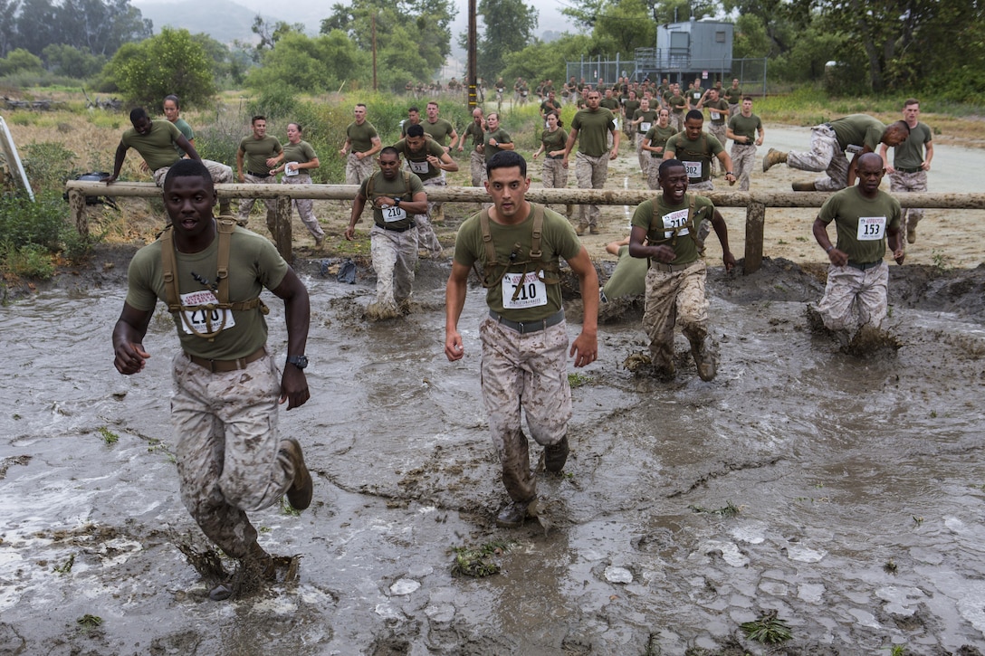 Approximately 2000 Marines and Sailors participated in the 2016 World Famous mud Run by Lake O'Neill here, June 3. The race was part of the Commanding General's Cup and covered about 6.5 miles. The race included a number of obstacles such as several mud pits, an ammo can run, a mud wall and many more. (U.S. Marine Corps photo by Cpl. Travis Jordan/Released)