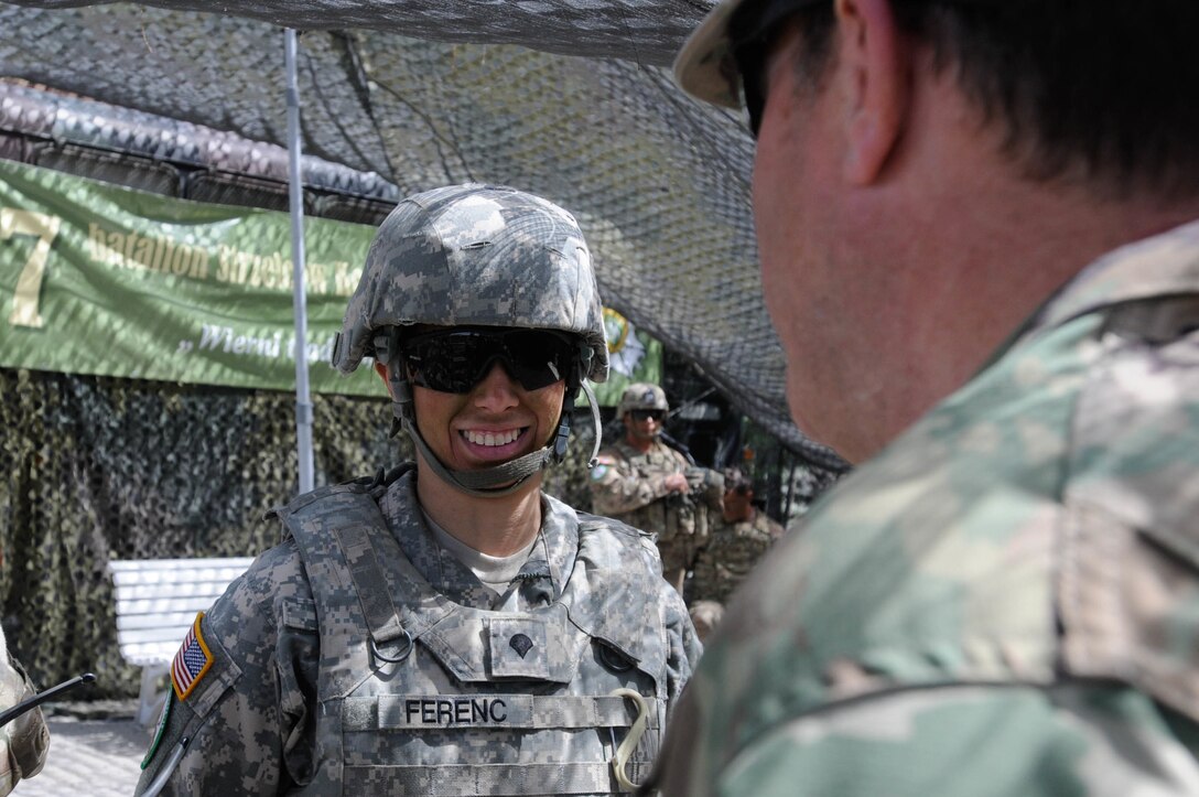 Spc. Mariola Ferenc, a Polish linguist with the 341st Military Intelligence Battalion, Illinois National Guard, speaks with Maj. Gen. Mark Palzer, commander of the 79th Sustainment Support Command, during a mass casualty response demonstration as part of Anakonda 2016, June 11, near Chełmno, Poland. Anakonda 2016 is one of U.S. Army Europe's premier multinational training events, which features 24 nations and seeks to train, exercise and integrate Polish national command and force structures into an allied, joint, multinational environment.