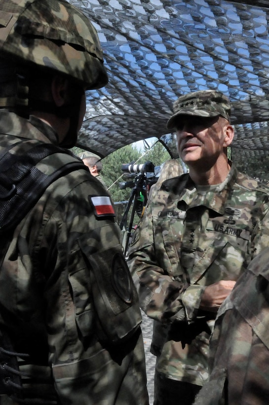 Lt. Gen. David E. Quantock, the U.S. Army Inspector General, speaks with a member of the Polish Army during a mass casualty response demonstration as part of Anakonda 2016, June 11, near Chełmno, Poland. Anakonda 2016 is one of U.S. Army Europe's premier multinational training events, which features 24 nations and seeks to train, exercise and integrate Polish national command and force structures into an allied, joint, multinational environment.