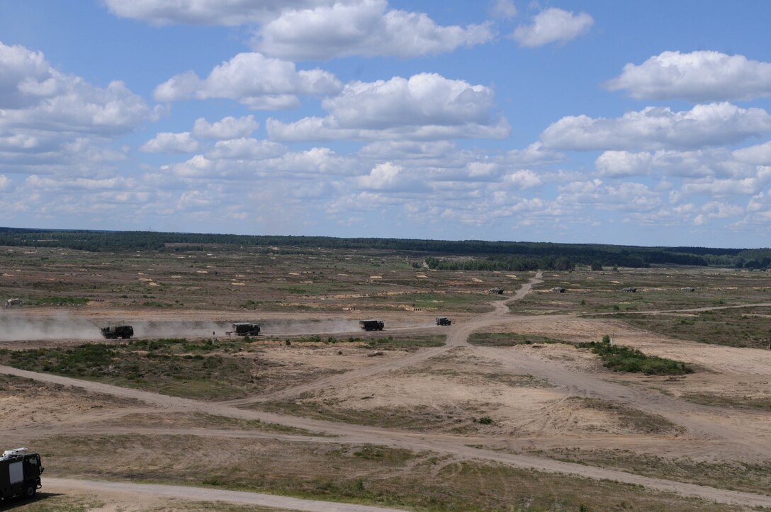 A convoy drives on a dirt road near Chełmno, Poland, during a mass casualty response demonstration, which featured the convoy, live explosives, and dozens of roleplayers in realistic combat wound make-up, as part of Anakonda 2016, June 11. Anakonda 2016 is one of U.S. Army Europe's premier multinational training events, which features 24 nations and seeks to train, exercise and integrate Polish national command and force structures into an allied, joint, multinational environment.