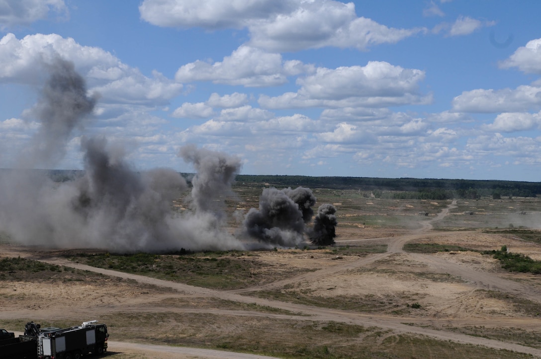 Smoke from a live detonation fills the sky during a mass casualty response demonstration, which featured the convoy, live explosives, and dozens of roleplayers in realistic combat wound make-up, as part of Anakonda 2016, June 11 in Chełmno, Poland. Anakonda 2016 is one of U.S. Army Europe's premier multinational training events, which features 24 nations and seeks to train, exercise and integrate Polish national command and force structures into an allied, joint, multinational environment.