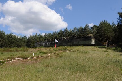 Members of the U.S. and Polish armies observe a mass casualty response demonstration from an observation point, which featured a convoy, live explosives, and dozens of roleplayers in realistic combat wound make-up, as part of Anakonda 2016, June 11, near Chełmno, Poland. Anakonda 2016 is one of U.S. Army Europe's premier multinational training events, which features 24 nations and seeks to train, exercise and integrate Polish national command and force structures into an allied, joint, multinational environment.