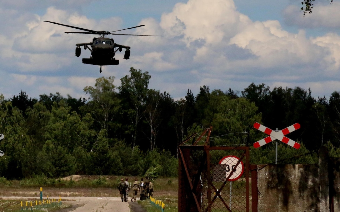 A U.S. Army aviation crew from the 1-214th Aviation Regiment, Alpha Company, Wiesbaden, Germany, prepares to pick up U.S. and Polish Soldiers during Anakonda 16 on a Polish base outside Warsaw, Poland June 12. Anakonda 16 is a Polish-led national event that seeks to train, exercise and integrate Polish national command and force structures into an Allied, joint, multinational environment. (Photo by Capt. A. Sean Taylor, 649th RSG)