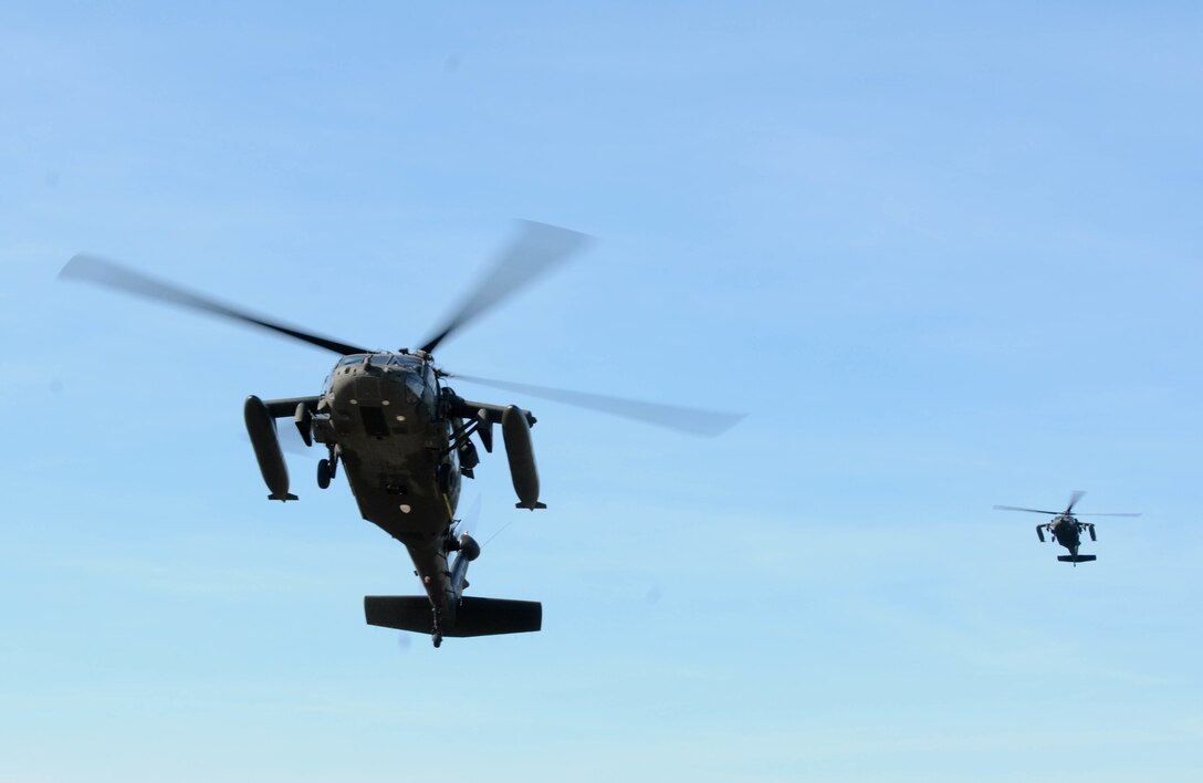 Two UH-60 Blackhawks, operated by the 1-214th Aviation Regiment, Alpha Company, prepare to land in Warsaw, Poland, June 9, as part of the training exercise Anakonda 2016. Anakonda 2016 is one of U.S. Army Europe's premier multinational training events, which features 24 nations and seeks to train, exercise and integrate Polish national command and force structures into an allied, joint, multinational environment.