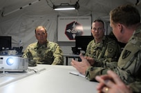 Maj. Gen. Duane A. Gamble, the commander of the 21st Theater Sustainment 
Command, and Brig. Gen. Gregory J. Mosser, commander of the 364th Expeditionary Sustainment Command, brief Lt. Gen. Ben Hodges, commander of U.S. Army Europe, regarding the successes and results of Anakonda 2016, June 9 in Warsaw, Poland. Anakonda 2016 is one of U.S. Army Europe's premier multinational training events, which features 24 nations and seeks to train, exercise and integrate Polish national command and force structures into an allied, joint, multinational environment.