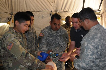 2nd Medical Brigade soldiers Spc. Jesus Calderon of Salinas, Calif. and Pvt. Cristoval Reyes of Stockton, Calif. practice endotracheal intubation during the annual training exercise at Camp Parks, Calif.  Big Logistics Over-The-Shore, West is an annual, Army Reserve, multi-echelon functional exercise designed for transportation units and sustainment commands to hone their expertise in Logistics Over-the-Shore (LOTS) operations from June 10 to June 24, 2016.  Big LOTS West is a multi-component exercise involving elements from the Active Component Army, U.S. Navy, U.S. Air Force, U.S. Coast Guard, and U.S. Maritime Administration are conducting operations at three Bay-Area California training locations: Camp Parks, Alameda Point, and Coast Guard Island.