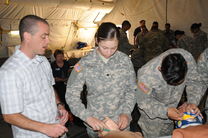 Ted Langevin, a volunteer with CALSTAR, teaches 2nd Medical Brigade Soldier Spc. Jasmaine Rodriguez, A 92G food service specialist From Chico California, the proper method for surgical cricothyrotomy during the annual training exercise at Camp Parks, Calif.  Big Logistics Over-The-Shore, West is an annual, Army Reserve, multi-echelon functional exercise designed for transportation units and sustainment commands to hone their expertise in Logistics Over-the-Shore (LOTS) operations from June 10 to June 24, 2016.  Big LOTS West is a multi-component exercise involving elements from the Active Component Army, U.S. Navy, U.S. Air Force, U.S. Coast Guard, and U.S. Maritime Administration are conducting operations at three Bay-Area California training locations: Camp Parks, Alameda Point, and Coast Guard Island.