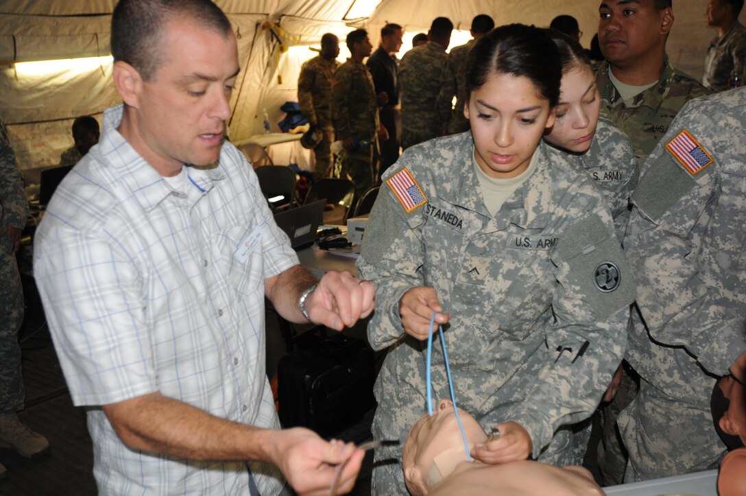 Ted Langevin, a volunteer with CALSTAR, teaches 2nd Medical Brigade Soldiers the proper method for surgical cricothyrotomy during the annual training exercise at Camp Parks, Calif.  Big Logistics Over-The-Shore, West is an annual, Army Reserve, multi-echelon functional exercise designed for transportation units and sustainment commands to hone their expertise in Logistics Over-the-Shore (LOTS) operations from June 10 to June 24, 2016.  Big LOTS West is a multi-component exercise involving elements from the Active Component Army, U.S. Navy, U.S. Air Force, U.S. Coast Guard, and U.S. Maritime Administration are conducting operations at three Bay-Area California training locations: Camp Parks, Alameda Point, and Coast Guard Island.