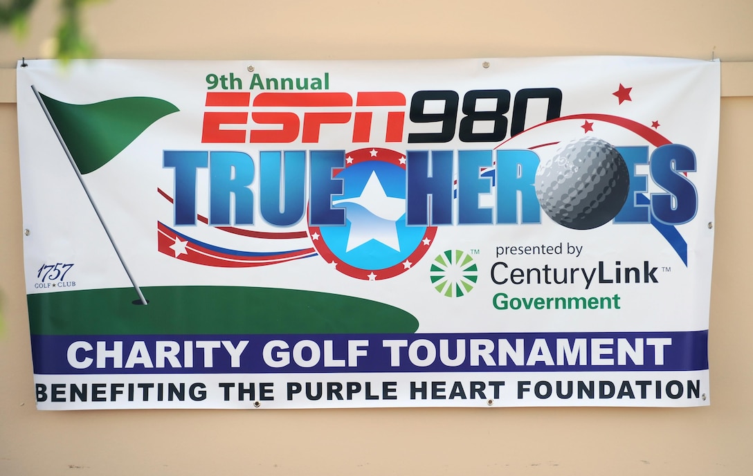 A sign announces the 9th Annual ESPN 980 True Heroes Charity Golf Tournament at the 1757 Golf Club in Sterling, Va., June 13, 2016. The event benefitted the Purple Heart Foundation. DoD photo by Marvin D. Lynch