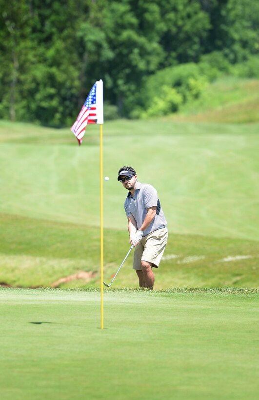 Pete LeFevre makes a difficult pitch shot during the 9th Annual ESPN 980 True Heroes Charity Golf Tournament to benefit the Purple Heart Foundation at the 1757 Golf Club in Sterling, Va., June 13, 2016. DoD photo by Marvin D. Lynchard 