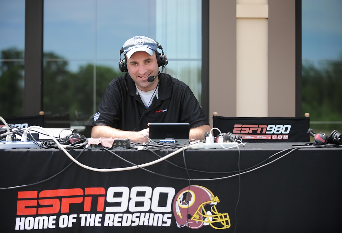 Tim Shovers of ESPN 980 broadcasts from the 1757 Golf Club during the 9th Annual ESPN 980 True Heroes Charity Golf Tournament to benefit the Purple Heart Foundation in Sterling, Va., June 13, 2016. DoD photo by Marvin D. Lynchard 