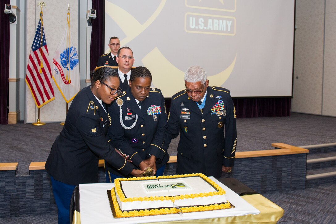 Members of Patrick Air Force Base and Cape Canaveral Air Force Station, Fla. celebrated the U.S. Army’s 241st Birthday during a cake cutting ceremony at Defense Equal Opportunity Management Institute June 14, 2016. Medal of Honor recipient retired Sergeant 1st Class Melvin Morris, was the guest speaker for the event and shared his feelings about how honored he is to be a part of the military family and shared stories from his days on active duty. (U.S. Air Force photo/Benjamin Thacker/Released) 