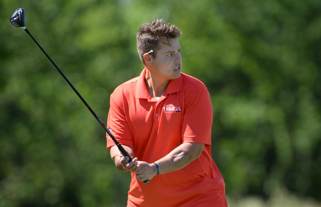 Nick Thom, a Marine Corps veteran, prepares to tee off during the 9th Annual ESPN 980 True Heroes Charity Golf Tournament at the 1757 Golf Club in Sterling, Va., June 13, 2016. DoD photo by Marvin D. Lynchard 