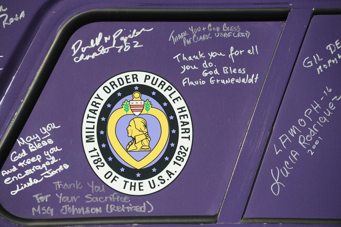 Signatures of supporters adorn a Purple Heart Foundation vehicle at the 1757 Golf Club in Sterling, Va., June 13, 2016. The vehicle was on display during the 9th Annual ESPN 980 True Heroes Charity Golf Tournament benefiting the foundation. DoD photo by Marvin D. Lynchard 