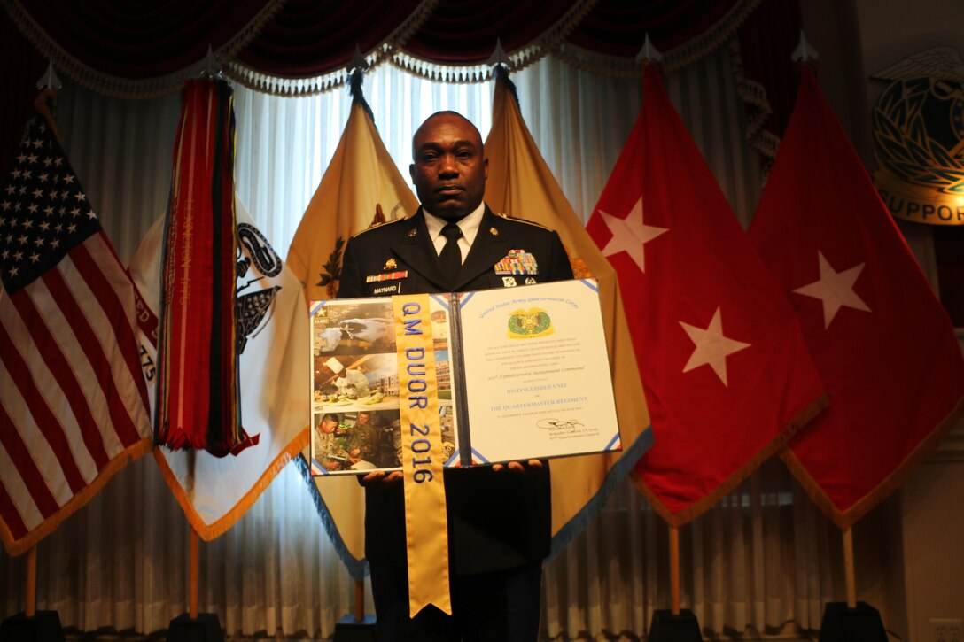 Command Sgt. Maj. Levi G. Maynard, the senior enlisted advisor for the 310th Sustainment Command (Expeditionary) (center right), represented the 310th ESC while receiving the Distinguished Unit of the Regiment award at the United States Army Quartermaster School Regimental Honors Ceremony, an annual event that honors distinguished members and units of the Quartermaster Corps for their achievements and service in the Army Sustainment community at Fort Lee, Va., 10 June, 2016.