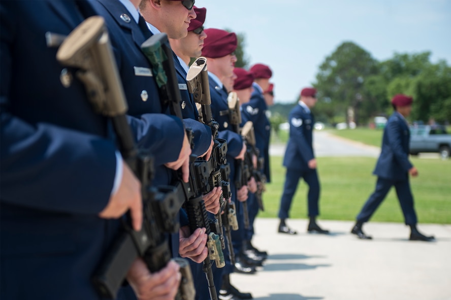 U.S. Air Force Airmen from the 38th Rescue Squadron prepare to perform a seven-man firing party in remembrance of Airman 1st Class Christopher O’Brien, June 10, 2016, at Moody Air Force Base, Ga. The pararesucemen honored O’Brien by executing three rounds using their M-4 rifles. (U.S. Air Force photo by Senior Airman Ceaira Tinsley/Released)