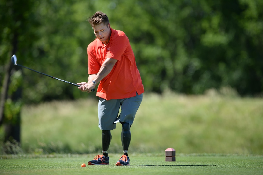 Nick Thom, a Marine Corps veteran, tees off during the 9th Annual ESPN 980 True Heroes Charity Golf Tournament at the 1757 Golf Club in Sterling, Va., June 13, 2016. DoD photo by Marvin D. Lynchard 