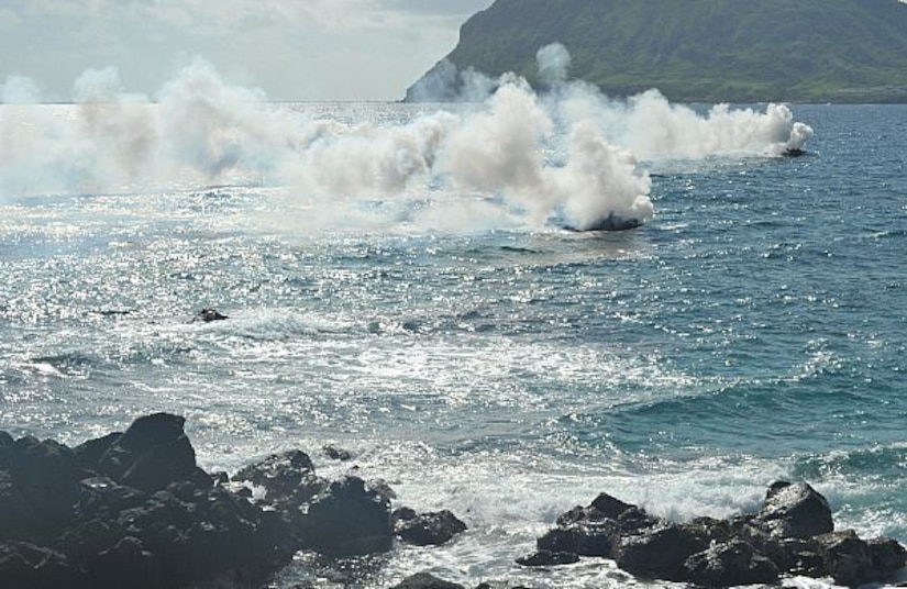 Service members from partner nations maneuver amphibious assault vehicles toward shore during a simulated beach assault as part of the Rim of the Pacific Exercise 2014, July 29, 2014. The world’s largest international maritime exercise, the 2016 iteration of Rimpac starts June 30 will involve 27 nations. The exercise provides a training opportunity that helps participants foster and sustain the cooperative relationships that are critical to ensuring the safety of sea lanes and security on the world's oceans. Navy photo by Petty Officer 2nd Class Corey T. Jones