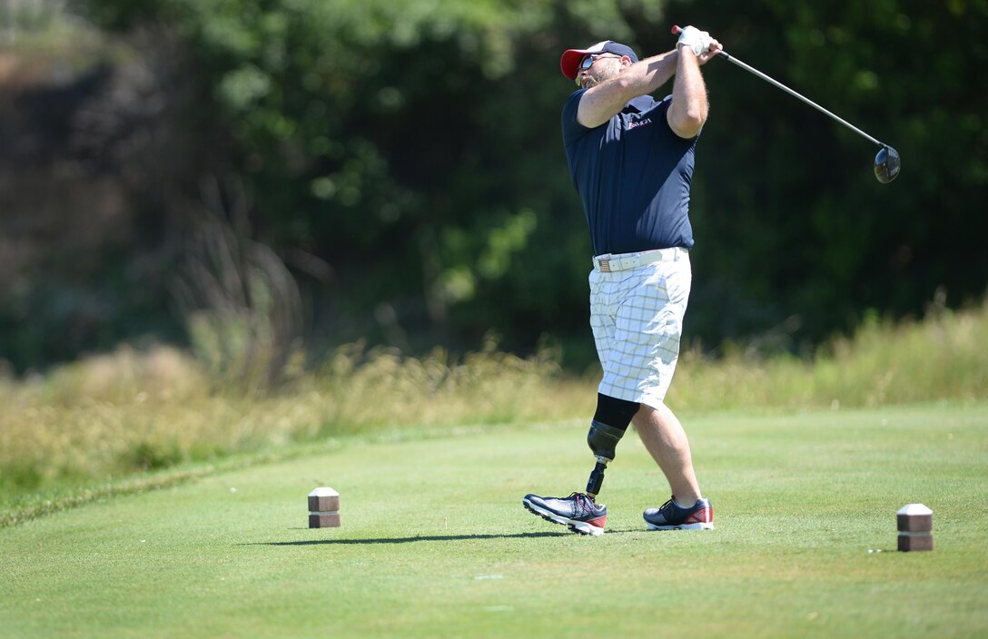 Chris Bowers, a Marine Corps veteran, tees off during the 9th Annual ESPN 980 True Heroes Charity Golf Tournament at the 1757 Golf Club in Sterling, Va., June 13, 2016. DoD photo by Marvin D. Lynchard 