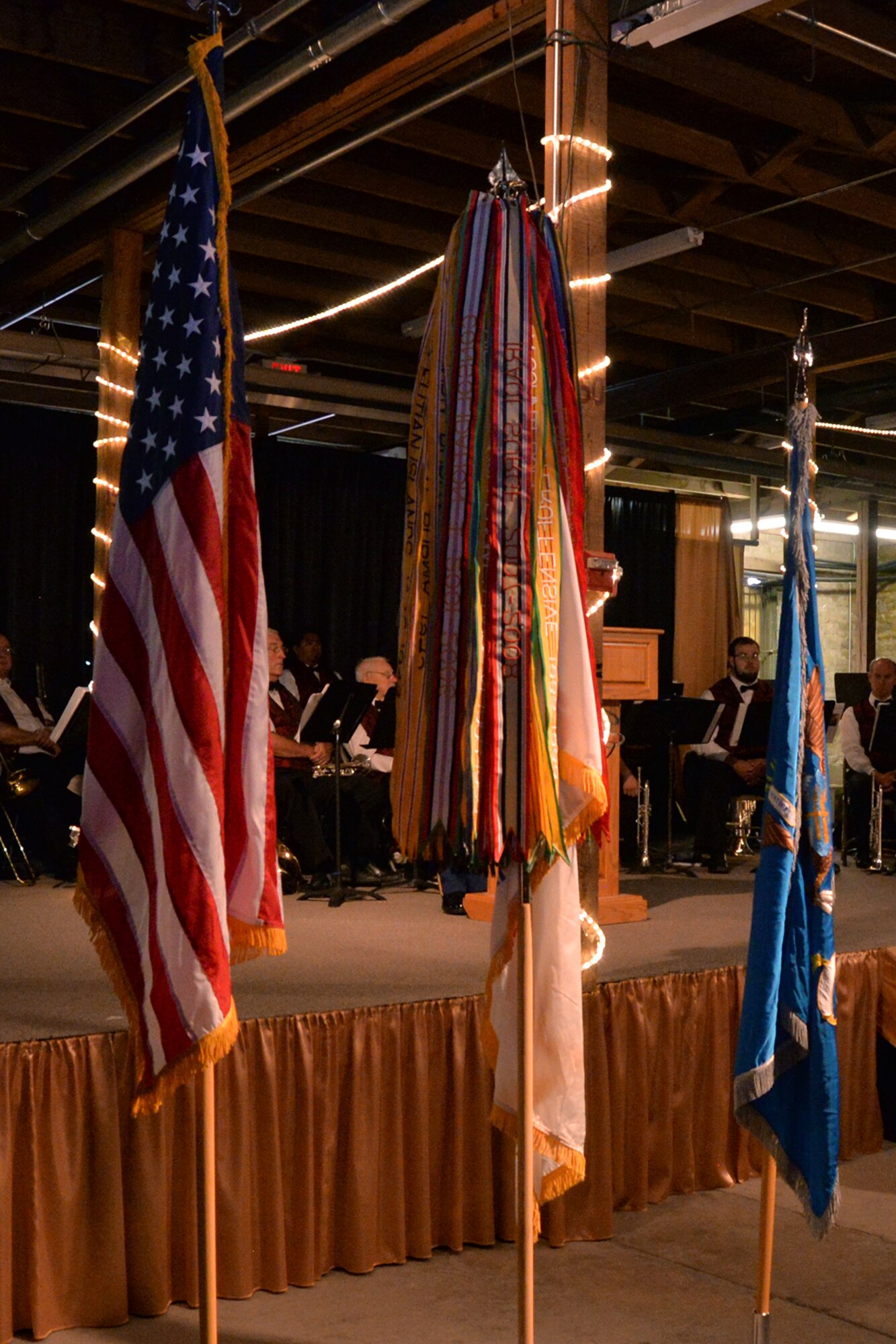 The United States flag stands beside the U.S. Army flag during the 344th Military Intelligence Battalion Army Ball at the Fort Concho Stables in San Angelo, Texas, June 10, 2016. The streamers attached to the Army flag represent each war and campaign the U.S. Army has fought in. (U.S. Air Force photo by Airman 1st Class Randall Moose/Released)