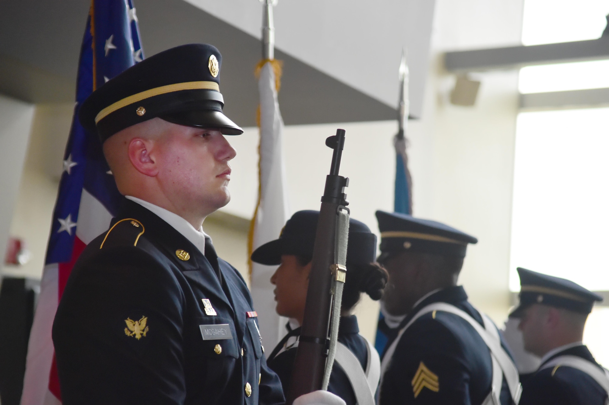 Spc. Christopher McGahey, 743rd Military Intelligence Battalion analyst, stands at attention during the presentation of the colors during the 743rd MIB 2016 Army Ball June 10, 2016, at Sports Authority Field at Mile High in Denver. The 743rd MIB held a ball in honor of the Army’s 241st birthday. (U.S. Air Force photo by Airman 1st Class Luke W. Nowakowski/Released)