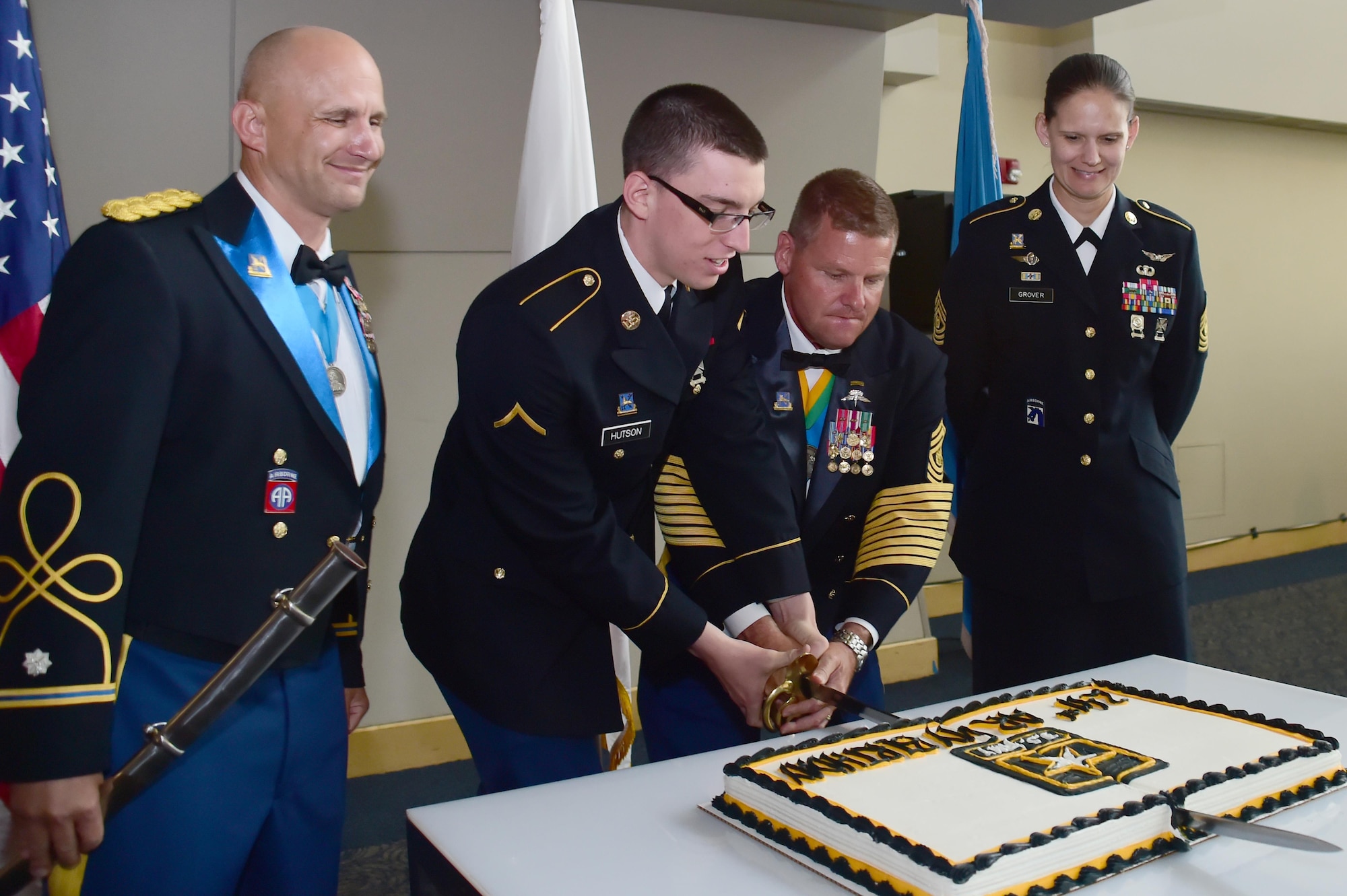 U.S. Army Sgt. Maj. Ramond Ramsey, 743rd Military Intelligence Battalion, and Pvt. Jacob Hudson, 743rd MIB analyst, cut the cake in celebration of the Army’s 241st birthday June 10, 2016, at Sports Authority Field at Mile High in Denver. The 743rd MIB held their annual ball which recognizes the U.S. Army’s birthday each year. (U.S. Air Force photo by Airman 1st Class Luke W. Nowakowski/Released)