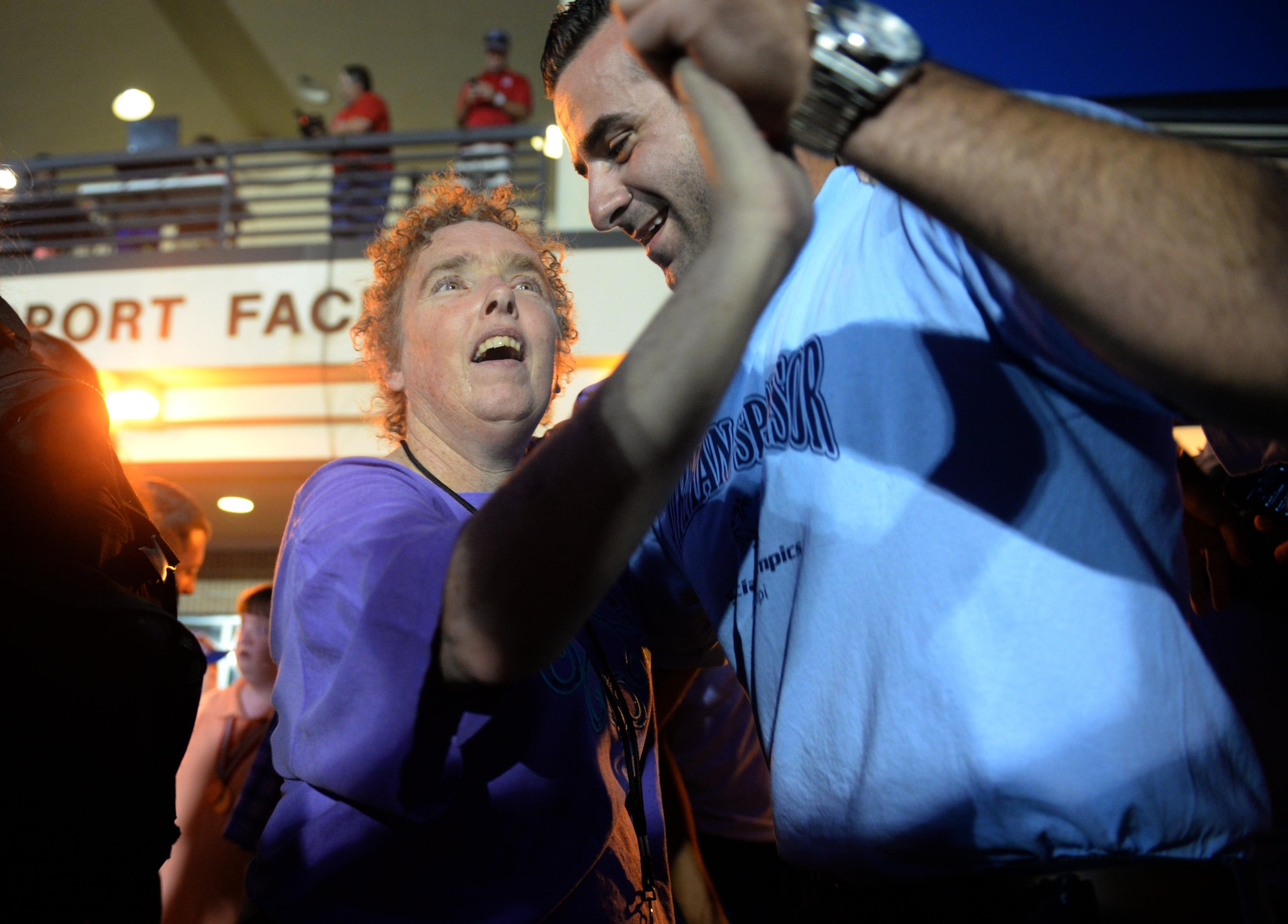 Paula Carpenter, District 5 Special Olympics Mississippi athlete, dances with Senior Airman Hashim Mefleh, 336th Training Squadron student, at the SOMS dance May 21, 2016, Keesler Air Force Base, Miss. Carpenter wanted to share her first dance with Mefleh, one of her Airmen sponsors, to celebrate a successful day of competition. (U.S. Air Force photo by Airman 1st Class Travis Beihl)