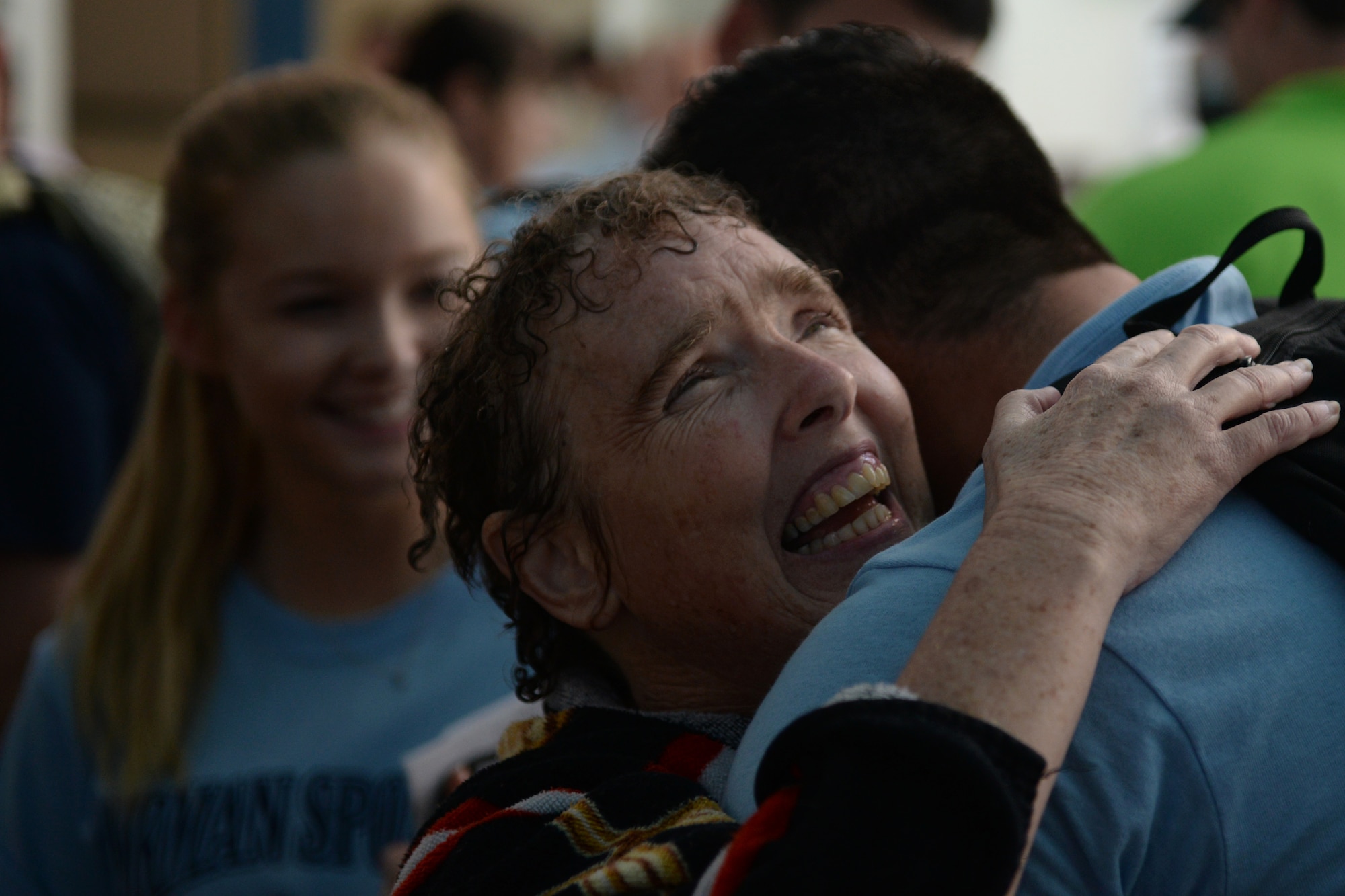 Paula Carpenter, District 5 Special Olympics Mississippi athlete, hugs Senior Airman Hashim Mefleh, 336th Training Squadron student, after finishing the 50 meter backstroke at the Biloxi Natatorium May 21, 2016, Biloxi, Miss. Mefleh, one of Carpenter’s Airman sponsors, cheered her on in her three aquatics events and got to know her for the three days of Special Olympics. (U.S. Air Force photo by Airman 1st Class Travis Beihl)