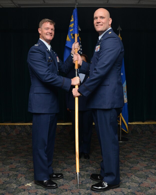 Maj. Brian Erickson, right, 47th Comptroller Squadron commander, poses for a photo with Col. Thomas Shank, 47th Flying Training Wing commander, during a change of command at Laughlin Air Force Base, Texas, May 25, 2016. Erickson came to Laughlin from his previous position as an executive officer at headquarters Air Education and Training Command. (U.S. Air Force photo/Airman 1st Class Brandon May)