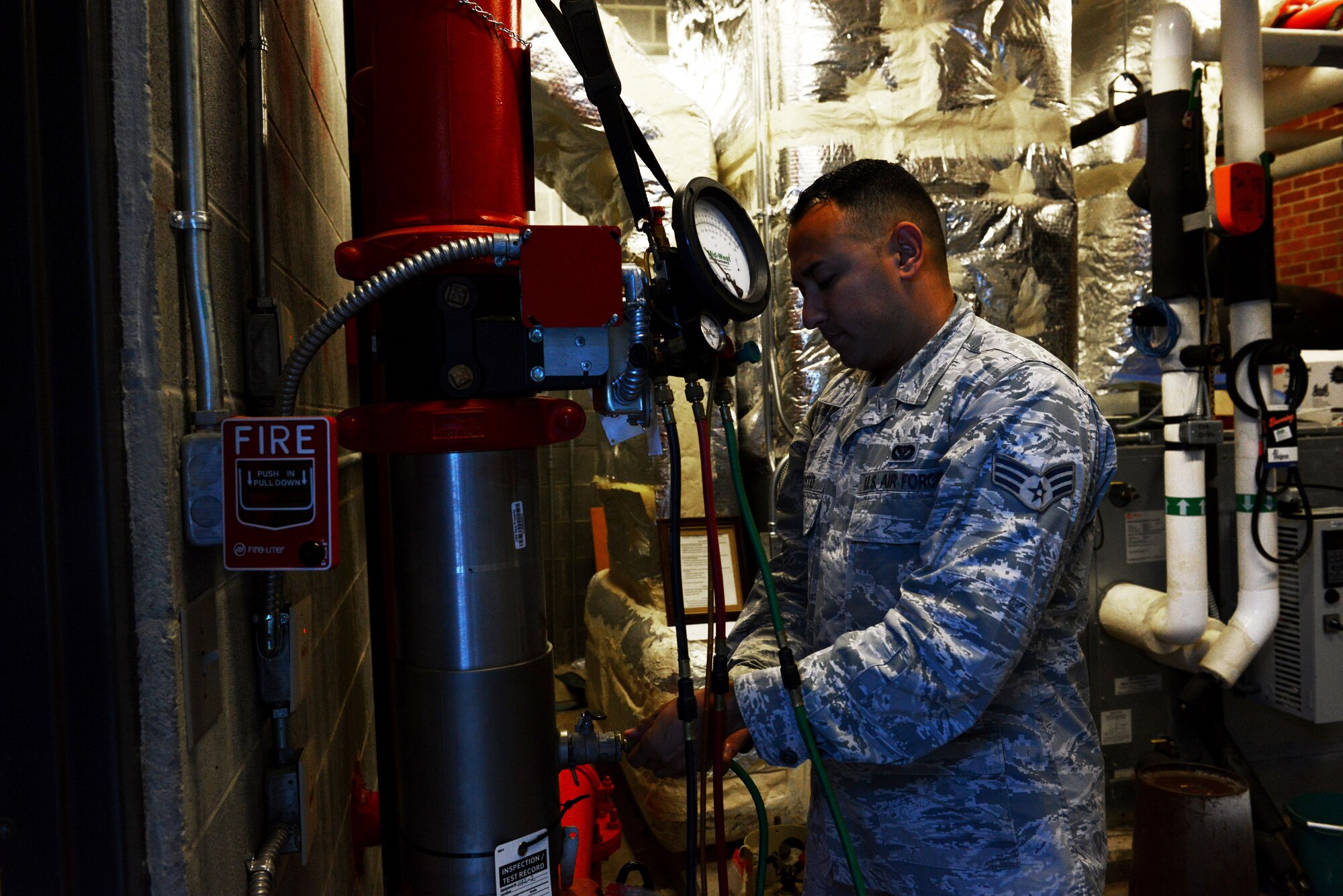 U.S. Air Force Senior Airman Rafael Agosto, 20th Civil Engineer Squadron water and fuel systems maintenance journeyman, tests a backflow device at Shaw Air Force Base, S.C., June 9, 2016. Backflow devices, which prevent contamination of the main water supply by only allowing water flow in one direction, are tested annually for proper function. (U.S. Air Force photo by Airman 1st Class Destinee Dougherty)