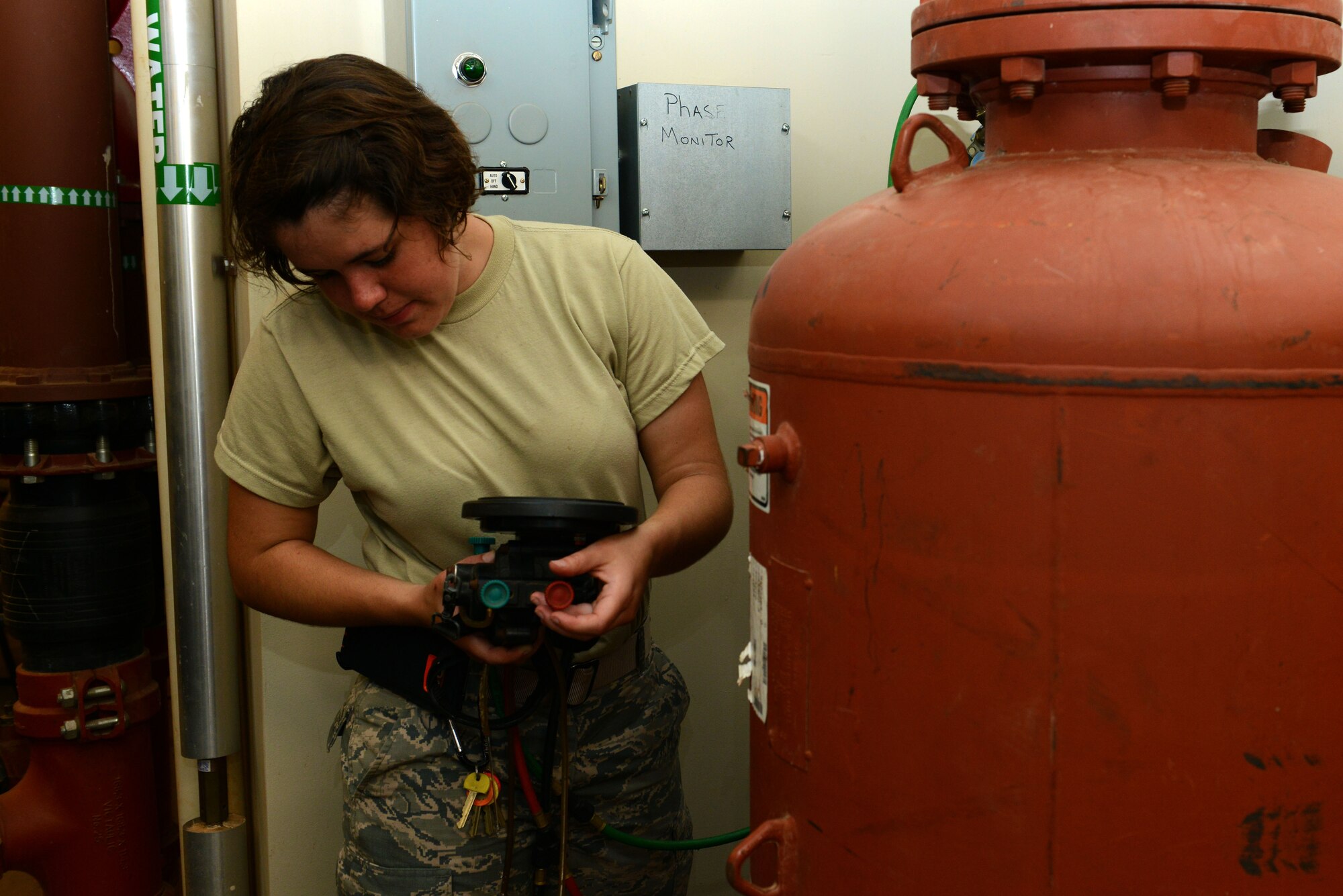 U.S. Air Force Airman 1st Class Emily Pickens, 20th Civil Engineer Squadron water and fuel systems maintenance apprentice, conducts a backflow test for a dormitory at Shaw Air Force Base, S.C., June 9, 2016. Altogether there are approximately 450 backflow devices preventing water contamination at Shaw, Wateree Recreation Area and Poinsett Electronic Combat Range. (U.S. Air Force photo by Airman 1st Class Destinee Dougherty)