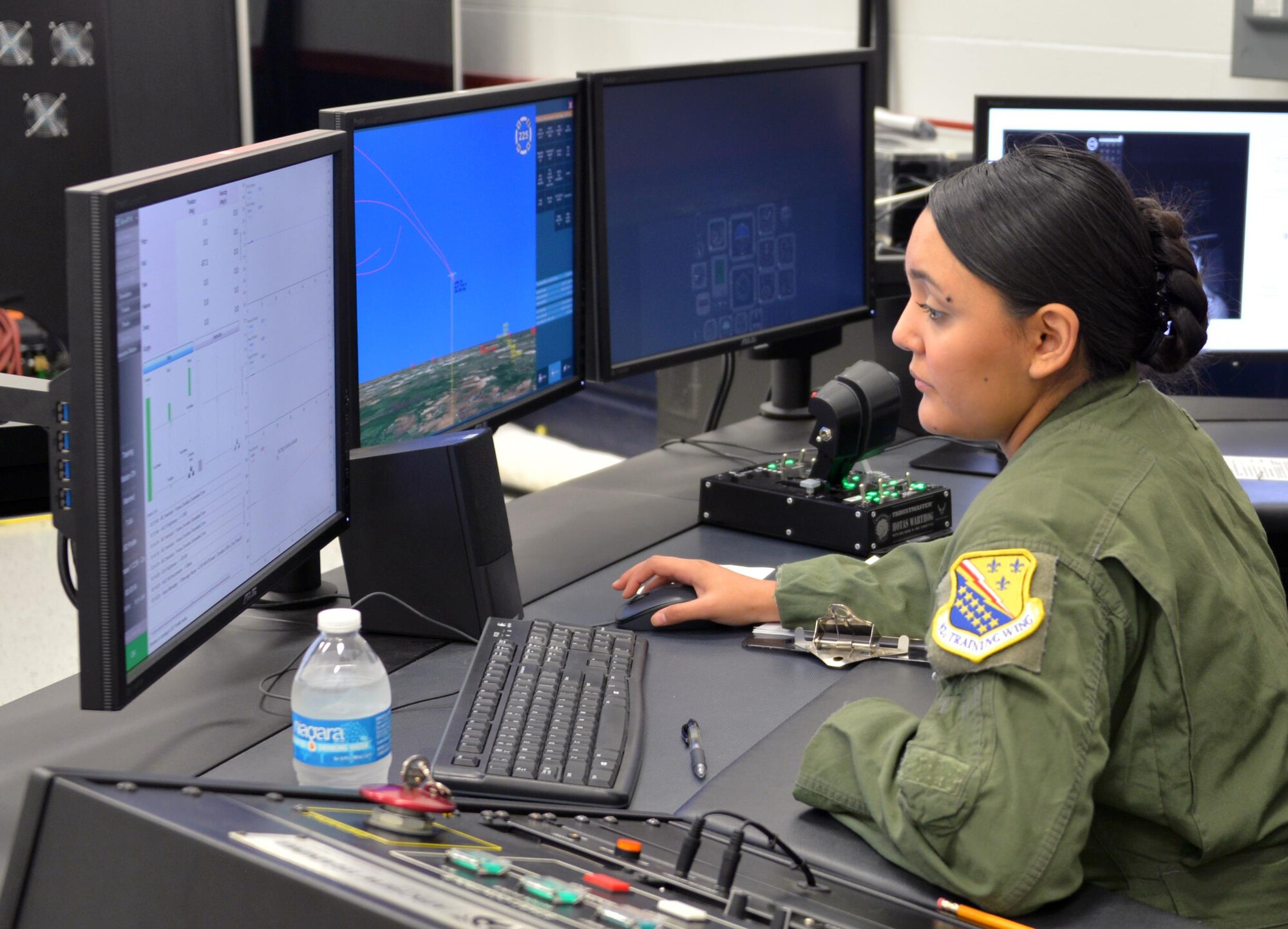 Senior Airman Alejandra Ortiz, 82nd Aerospace Medical Squadron technician operates the the GYRO Integrated Physiological Trainer II simulator during the first phase of ENJJPT training. The simulator allows student pilots to feel, recognize and correct the effects of spacial disorientation before they ever actually fly an airframe. (U.S. Air Force photo/Liz Colunga)