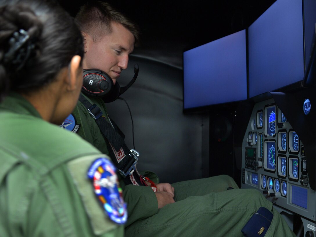 Senior Airman Alejandra Ortiz, 82nd Aerospace Medical Squadron technician prepares a student pilot before he trains using the GYRO Integrated Physiological Trainer II simulator during the first phase of ENJJPT training. The simulator allows student pilots to feel, recognize and correct the effects of spacial disorientation before they ever actually fly an airframe. (U.S. Air Force photo/Liz Colunga)