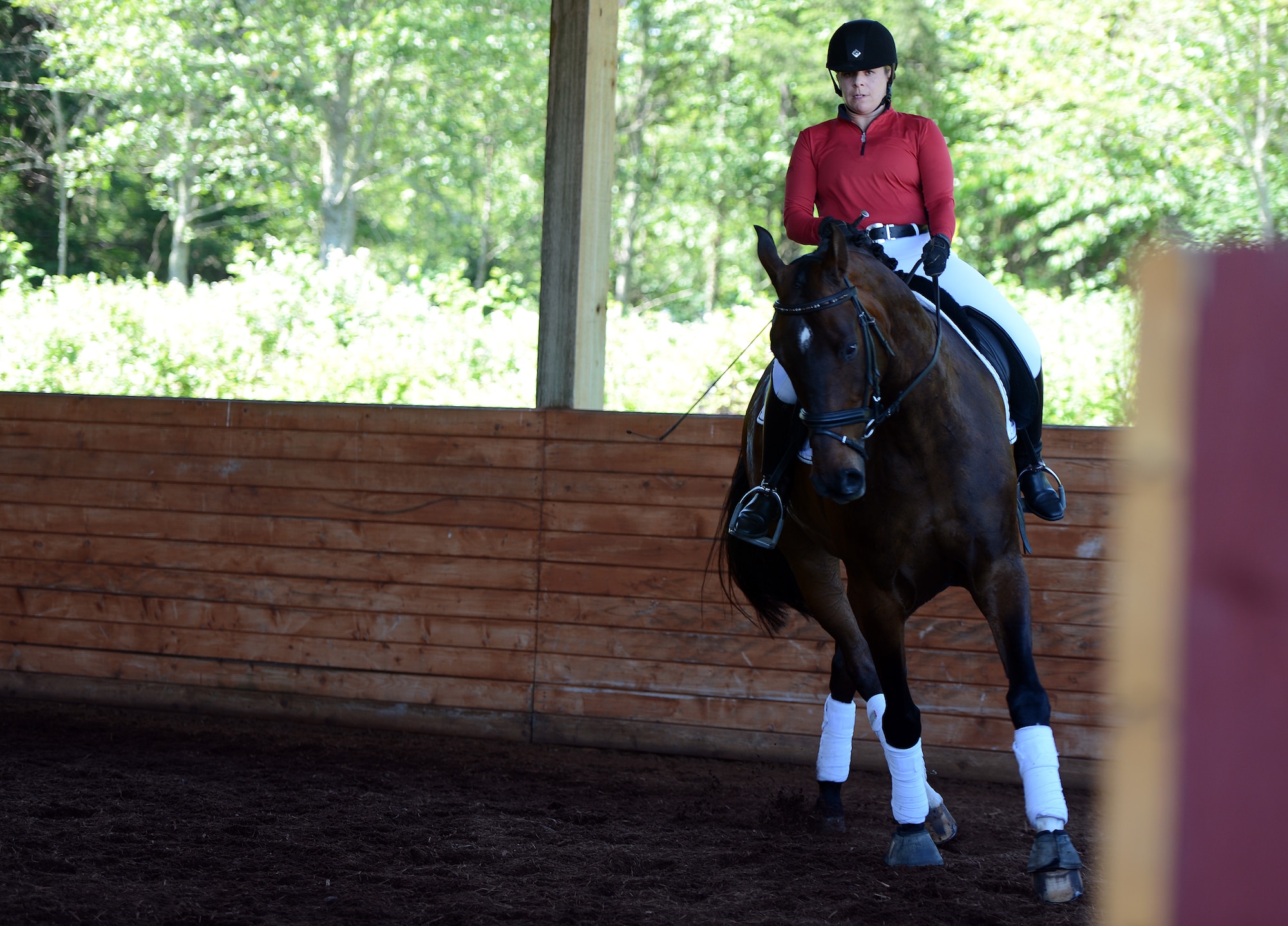 Maj. Jennifer Jones, 627th Communications Squadron director of operations, warms up prior to a dressage competition June 4, 2016, at the Summervale Premier Dressage show in Roy, Wash. Jones has competed in equestrian competitions such as Western Pleasure, Hunt Seat, Show Hunter, Eventing and cross-country equestrian. (U.S. Air Force photo/Senior Airman Jacob Jimenez) 
