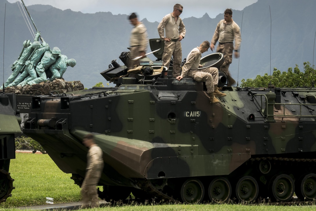 Marines with Combat Assault Company, 3rd Marine Regiment, inspect their Amphibious Assault Vehicle after coming ashore near the Pacific War Memorial aboard Marine Corps Base Hawaii, June 13, 2016. The CAC Marines practiced towing drills in Kaneohe Bay to gain a good understanding of what to do in the event an AAV breaks down or gets stuck.