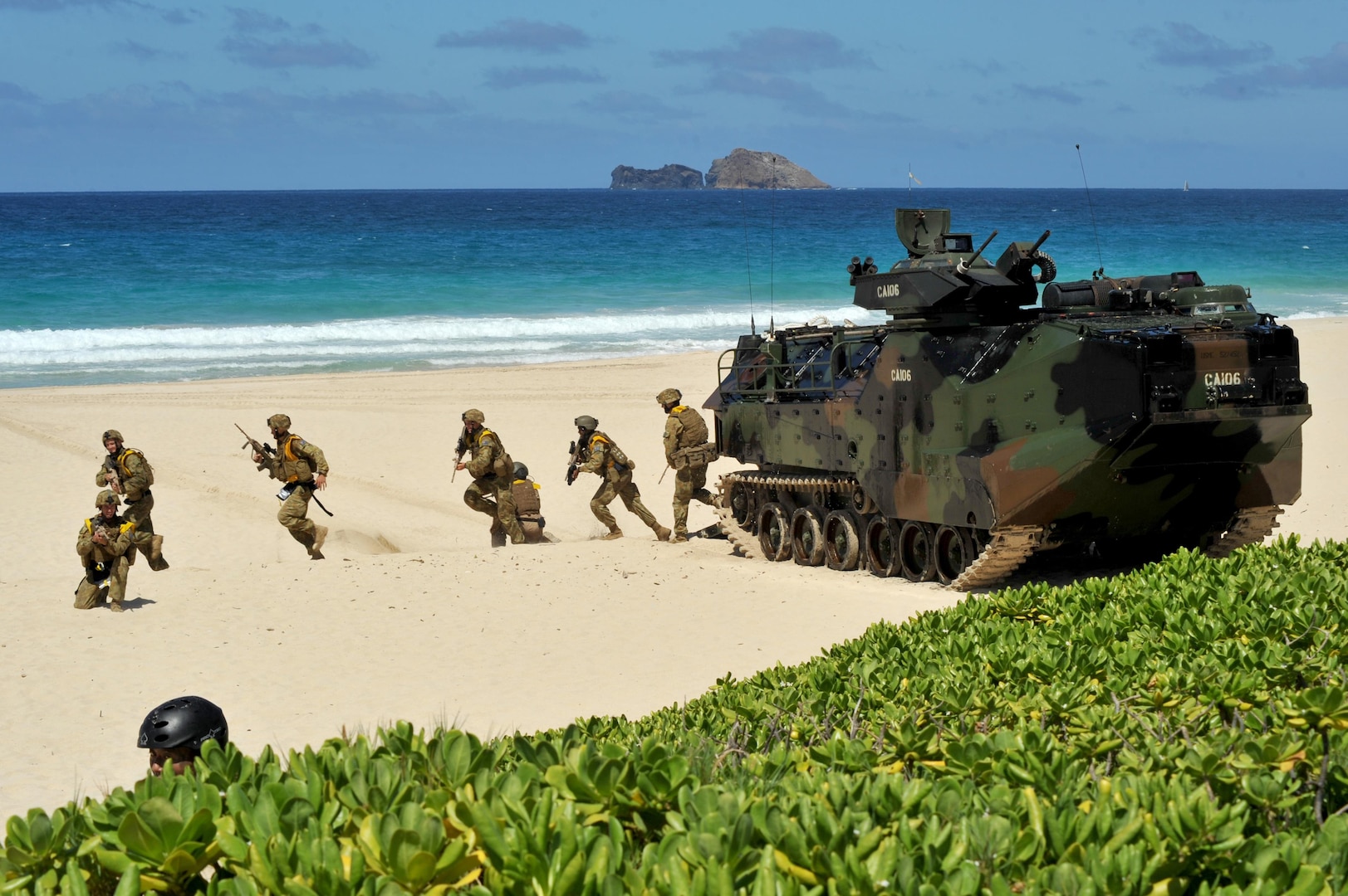 140728-N-UL721-192 MARINE CORPS BASE HAWAII (July 28, 2014) Royal Australian Navy sailors participate in a simulated beach assault during Rim of the Pacific (RIMPAC) Exercise 2014. Twenty-two nations, 49 ships, six submarines, more than 200 aircraft and 25,000 personnel are participating in RIMPAC from June 26 to Aug. 1, in and around the Hawaiian Islands and Southern California. The world's largest maritime exercise, RIMPAC provides a unique training opportunity that helps participants foster and sustain the cooperative relationships that are critical to ensuring the safety of sea lanes and security on the world's oceans. RIMPAC 2014 is the 24th exercise in the series that began in 1971. (U.S. Navy photo by Mass Communication Specialist 2nd Class Corey T. Jones/Released) 