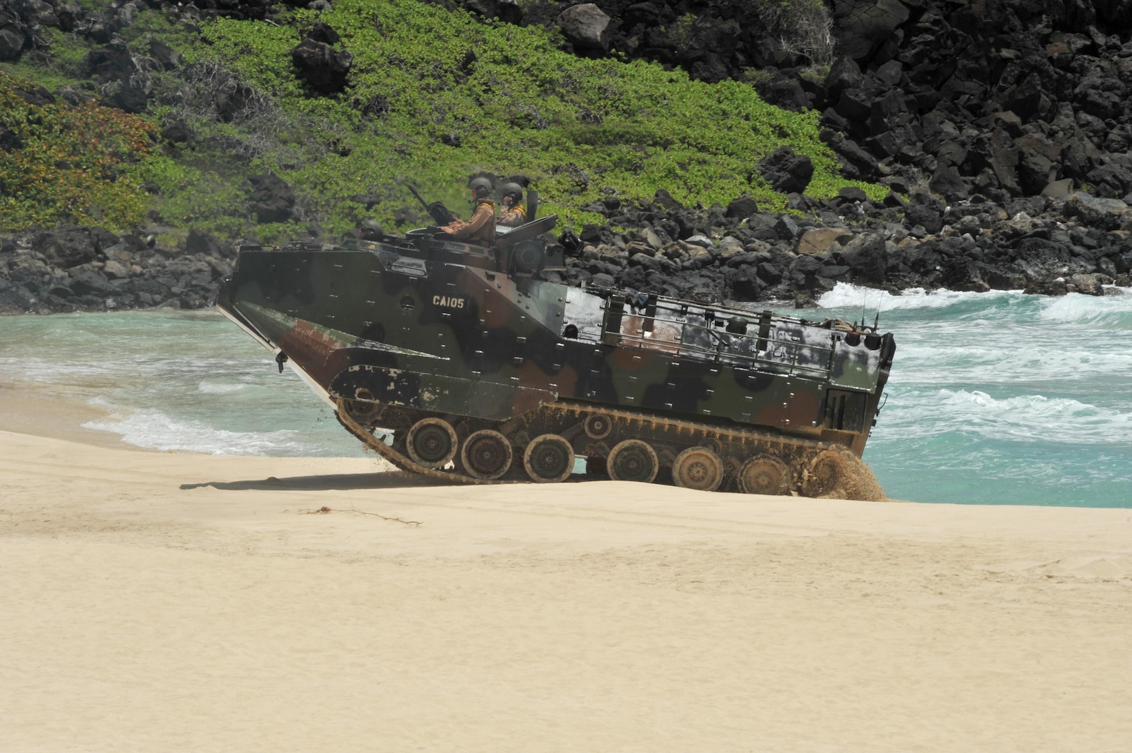 140728-N-UL721-362 MARINE CORPS BASE HAWAII (July 28, 2014) U.S. Marines drive an amphibious assault vehicle ashore during a simulated beach assault as part of Rim of the Pacific (RIMPAC) Exercise 2014. Twenty-two nations, 49 ships, six submarines, more than 200 aircraft and 25,000 personnel are participating in RIMPAC from June 26 to Aug. 1, in and around the Hawaiian Islands and Southern California. The world's largest maritime exercise, RIMPAC provides a unique training opportunity that helps participants foster and sustain the cooperative relationships that are critical to ensuring the safety of sea lanes and security on the world's oceans. RIMPAC 2014 is the 24th exercise in the series that began in 1971. (U.S. Navy photo by Mass Communication Specialist 2nd Class Corey T. Jones/Released)