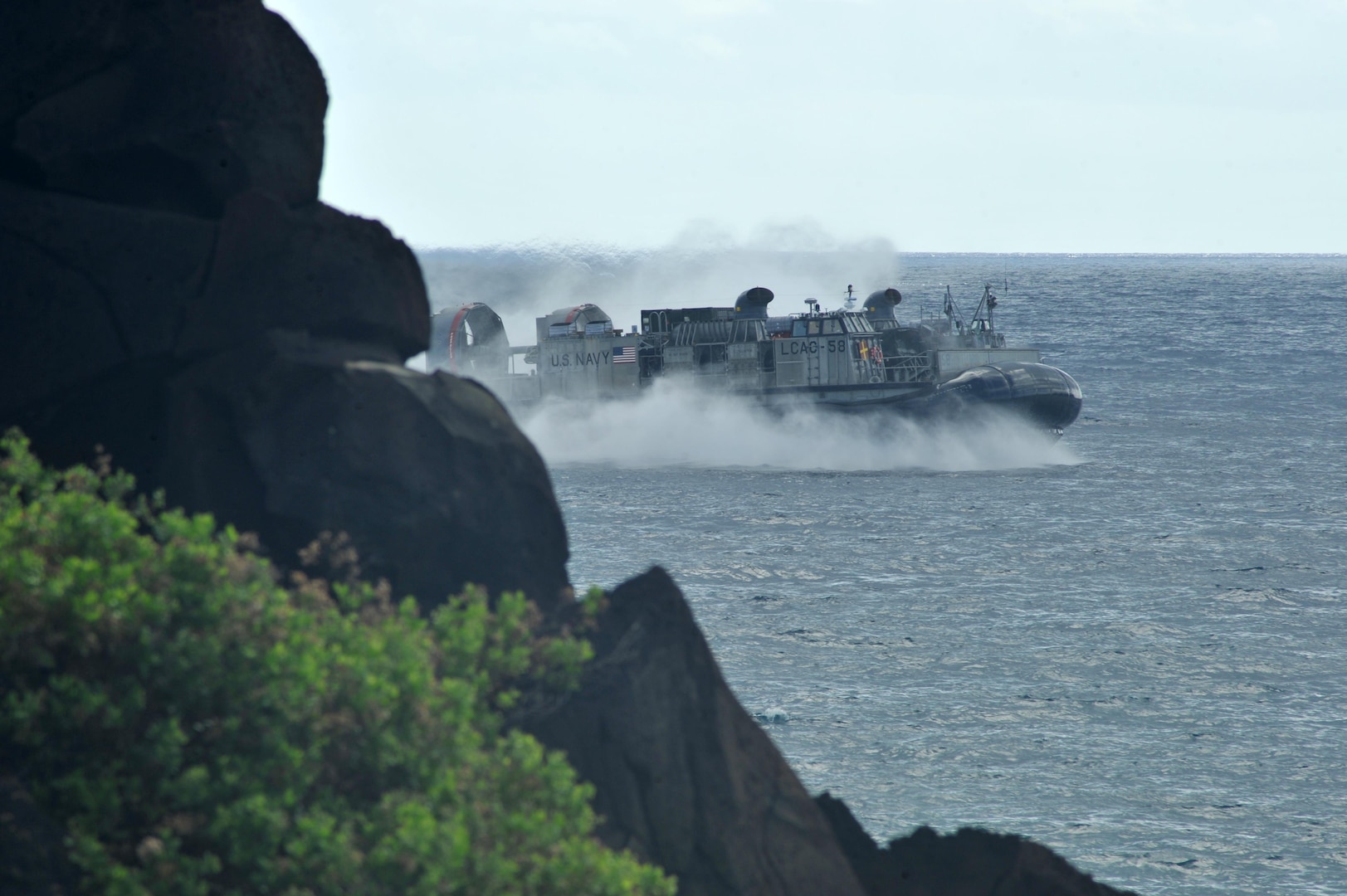 140729-N-UL721-082 MARINE CORPS BASE HAWAII (July 29, 2014) A U.S. Navy landing craft air cushion rehearses during a simulated beach assault during Rim of the Pacific (RIMPAC) Exercise 2014. Twenty-two nations, 49 ships, six submarines, more than 200 aircraft and 25,000 personnel are participating in RIMPAC from June 26 to Aug. 1, in and around the Hawaiian Islands and Southern California. The world's largest maritime exercise, RIMPAC provides a unique training opportunity that helps participants foster and sustain the cooperative relationships that are critical to ensuring the safety of sea lanes and security on the world's oceans. RIMPAC 2014 is the 24th exercise in the series that began in 1971. (U.S. Navy photo by Mass Communication Specialist 2nd Class Corey T. Jones/Released)