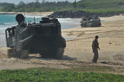 140729-N-UL721-104 MARINE CORPS BASE HAWAII (July 29, 2014) Service members from partner nations steer amphibious assault vehicles at the conclusion of a simulated beach assault during Rim of the Pacific (RIMPAC) Exercise 2014. Twenty-two nations, 49 ships, six submarines, more than 200 aircraft and 25,000 personnel are participating in RIMPAC from June 26 to Aug. 1, in and around the Hawaiian Islands and Southern California. The world's largest maritime exercise, RIMPAC provides a unique training opportunity that helps participants foster and sustain the cooperative relationships that are critical to ensuring the safety of sea lanes and security on the world's oceans. RIMPAC 2014 is the 24th exercise in the series that began in 1971. (U.S. Navy photo by Mass Communication Specialist 2nd Class Corey T. Jones/Released)
