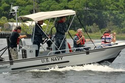 Navy Capt. Timothy Sparks gives a thumbs up during an Honorary Commander's tour of the 628th Security Forces Squadron harbor patrol mission at Joint Base Charleston, S.C., June 13, 2016. The Honorary Commander program provides an opportunity for local leaders to learn about the base's missions and culture. (U.S. Air Force photo/Tech. Sgt. Renae Pittman)