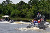 Commanders from Joint Base Charleston pair up with their honorary commanders for a tour of the Cooper River harbor patrol area at Joint Base Charleston, S.C., June 13, 2016. The program encourages local leaders to learn in-depth about the installation mission as well as increase understanding and cooperation between the civilian community and the Joint Base. (U.S. Air Force photo/Tech. Sgt. Renae Pittman)