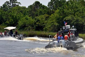 Commanders from Joint Base Charleston pair up with their honorary commanders for a tour of the Cooper River harbor patrol area at Joint Base Charleston, S.C., June 13, 2016. The program encourages local leaders to learn in-depth about the installation mission as well as increase understanding and cooperation between the civilian community and the Joint Base. (U.S. Air Force photo/Tech. Sgt. Renae Pittman)