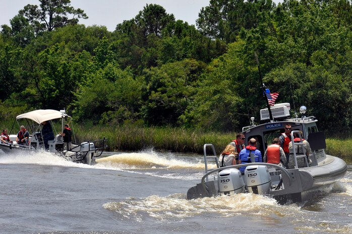 Commanders from Joint Base Charleston pair up with their honorary commanders for a tour of the Cooper River harbor patrol area at Joint Base Charleston, S.C., June 13, 2016. The program encourages local leaders to learn in-depth about the installation mission as well as increase understanding and cooperation between the civilian community and the Joint Base. (U.S. Air Force photo/Tech. Sgt. Renae Pittman)