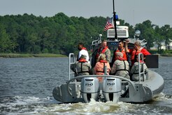 Commanders from Joint Base Charleston pair up with their honorary commanders for a tour of the Cooper River harbor patrol area at Joint Base Charleston, S.C., June 13, 2016. The program encourages local leaders to learn in-depth about the installation mission as well as increase understanding and cooperation between the civilian community and the Joint Base. (U.S. Air Force photo/Tech. Sgt. Renae Pittman)
