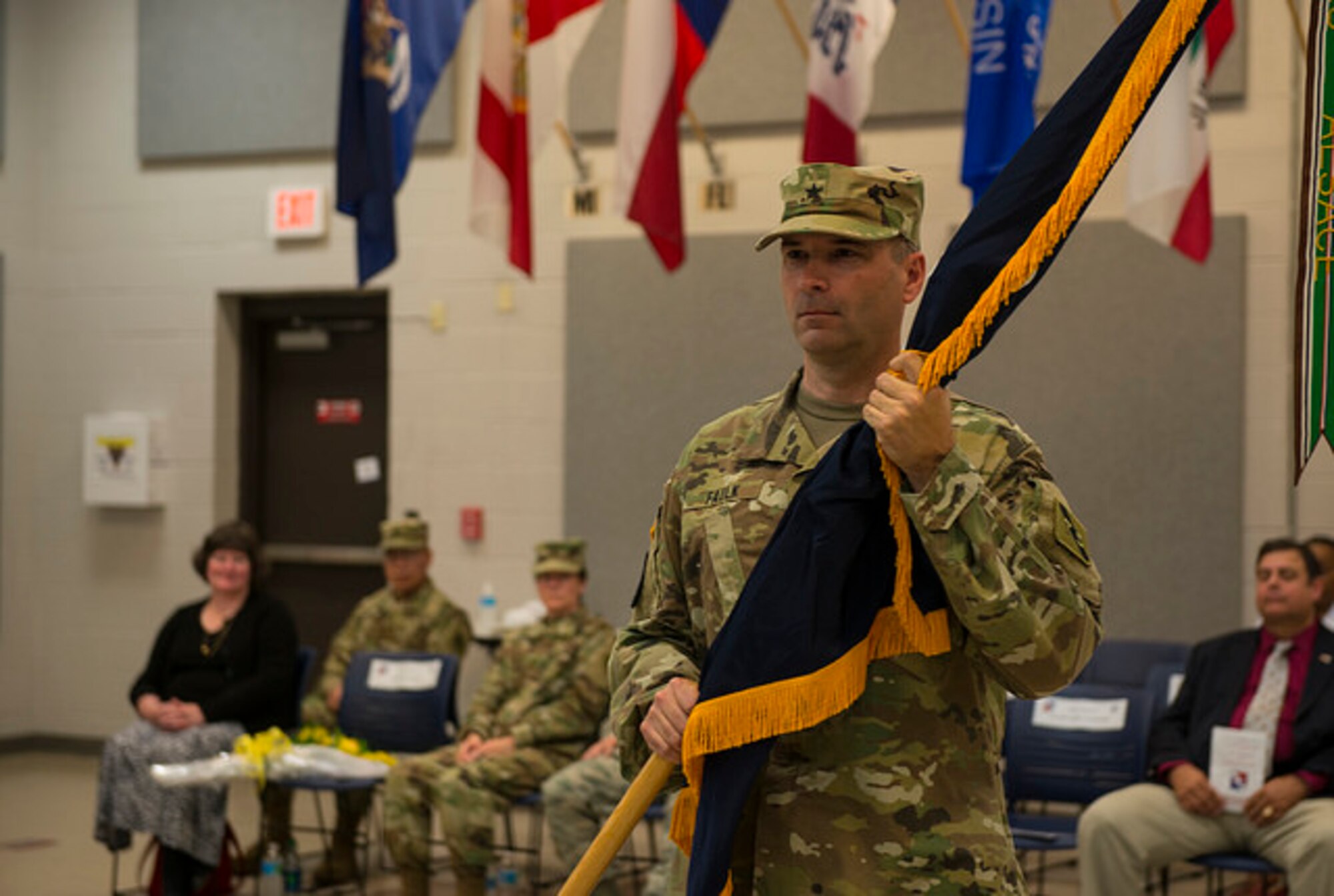 Brig. Gen. Rodney Faulk, Atlantic Training Division 75th Training Command commander, receives the guidon officially assuming his command of the unit, on Joint Base McGuire-Dix-Lakehurst, N.J. June 12. Faulk has served in the Army for 30 years and is from Battle Creek, Michigan. (U.S. Air Force photo by Senior Airman Joshua King)