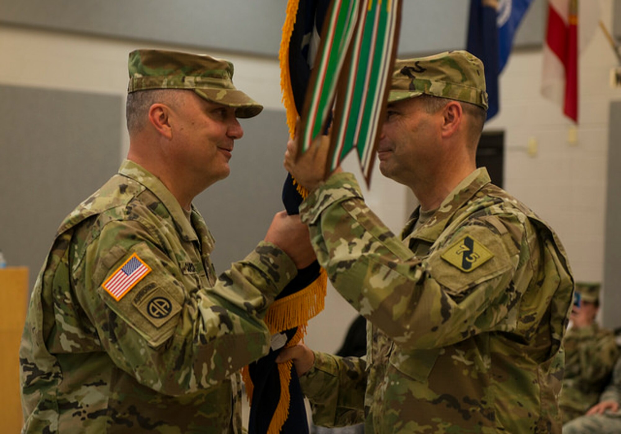 Brig. Gen. John Cardwell, 75th Training Command deputy commanding general, passes the guidon to Brig. Gen. Rodney Faulk, Atlantic Training Division 75th Training Command commander, during his assumption of command ceremony on Joint Base McGuire-Dix-Lakehurst, N.J. June 12. Faulk has been in the Army for 30 years and is from Battle Creek, Michigan.(U.S. Air Force photo by Senior Airman Joshua King)