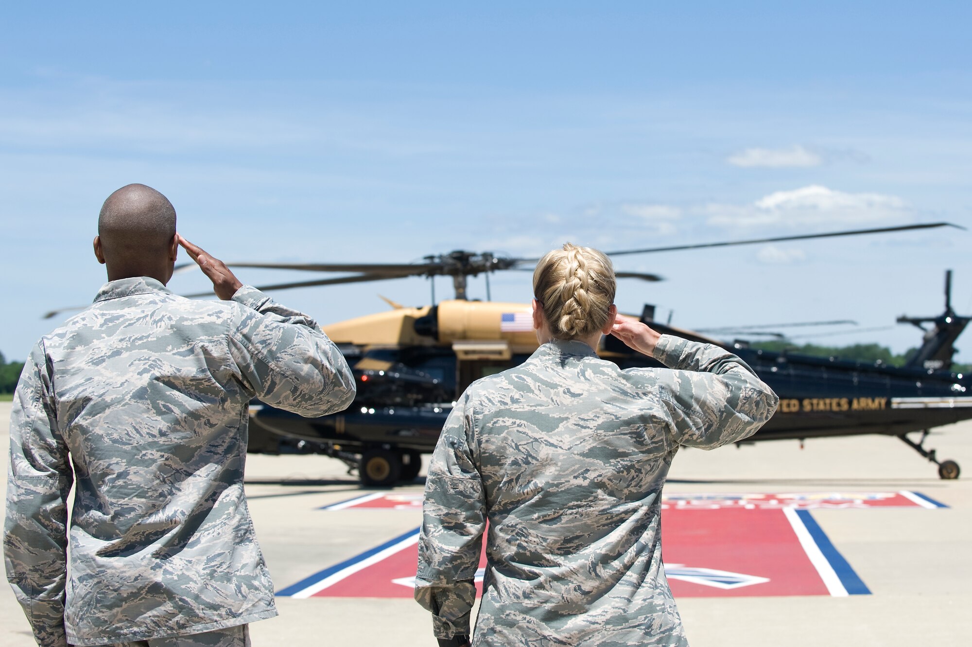 U.S. Marine Corps Gen. Joseph Dunford Jr., Chairman of the Joint Chiefs of Staff, is welcomed by a salute from U.S. Air Force Col. Caroline Miller, 633rd Air Base Wing commander, and 1st Lt. Nickalous Lewis, 633 Air Base Wing protocol officer, during his visit to Joint Base Langley-Eustis, Va., June 13, 2016. Dunford got a glimpse of JBLE’s missions as he toured the base alongside U.S. Air Force Gen. Hawk Carlisle, Air Combat Command commander. (U.S. Air Force photo by Airman 1st Class Kaylee Dubois)