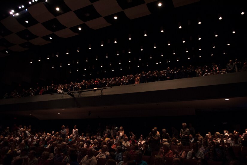 Audience members clap and sing along with the Air Force Song at the end of the U.S. Air Force Band’s 75th Anniversary celebration June 11, 2016, at George Mason University’s Center for the Arts Concert Hall in Fairfax, Va. There were 1,500 audience members watching and listening to the Air Force’s premier musical organization. (U.S. Air Force photo by Airman 1st Class Philip Bryant)